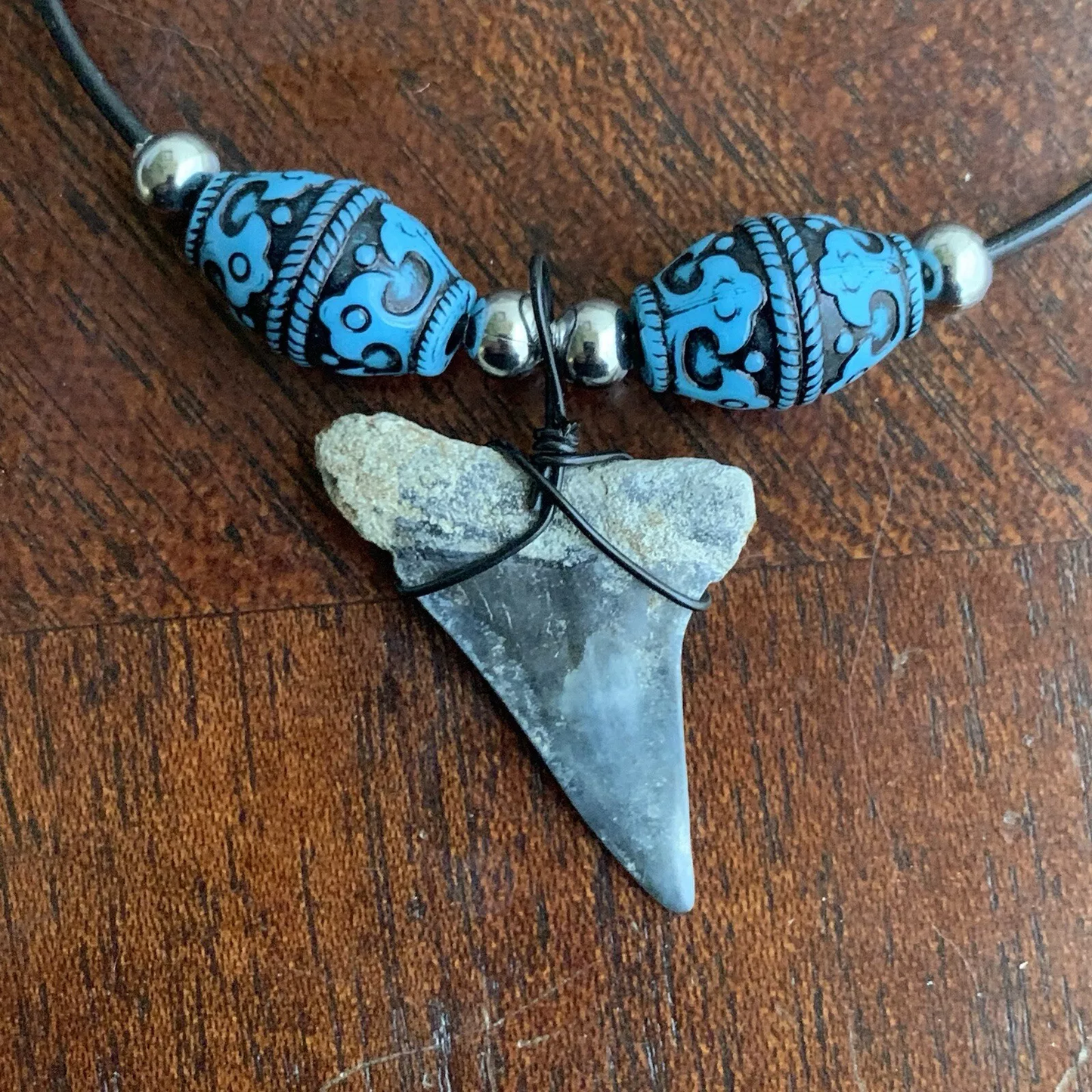 Real fossil Carcharodon hastalis shark tooth necklace on black cord, shark tooth pendant