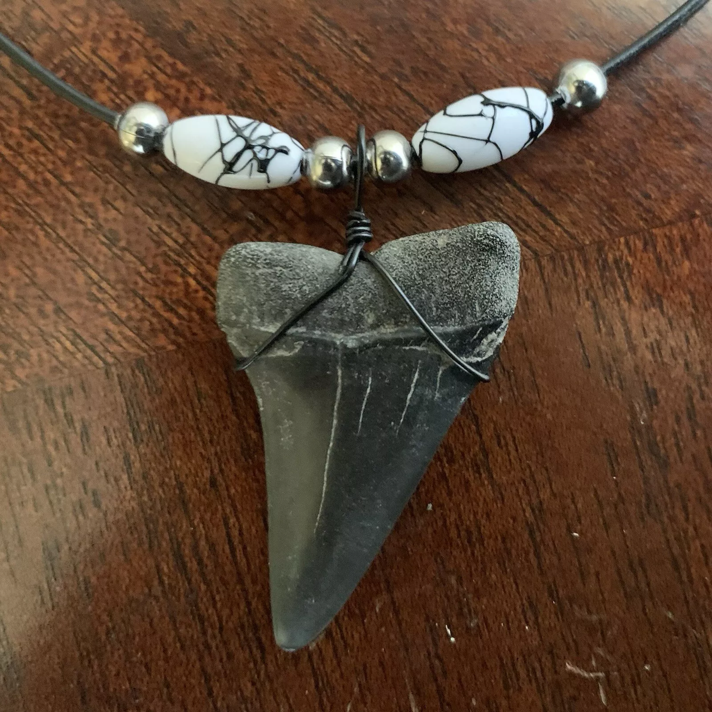Real fossil Carcharodon hastalis shark tooth necklace on black cord, shark tooth pendant