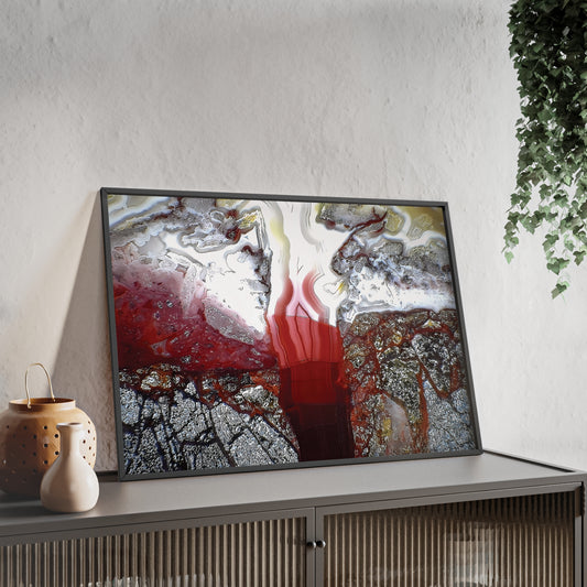 Wall art print capturing a captivating close-up photograph of a laguna lace agate with its white red and gray color. The picture is in a black frame and is leaning against the wall, on a low height cabinet, in the living room.